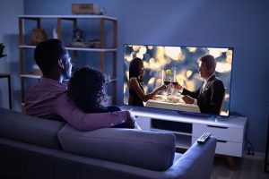 Couple streaming a movie at home.